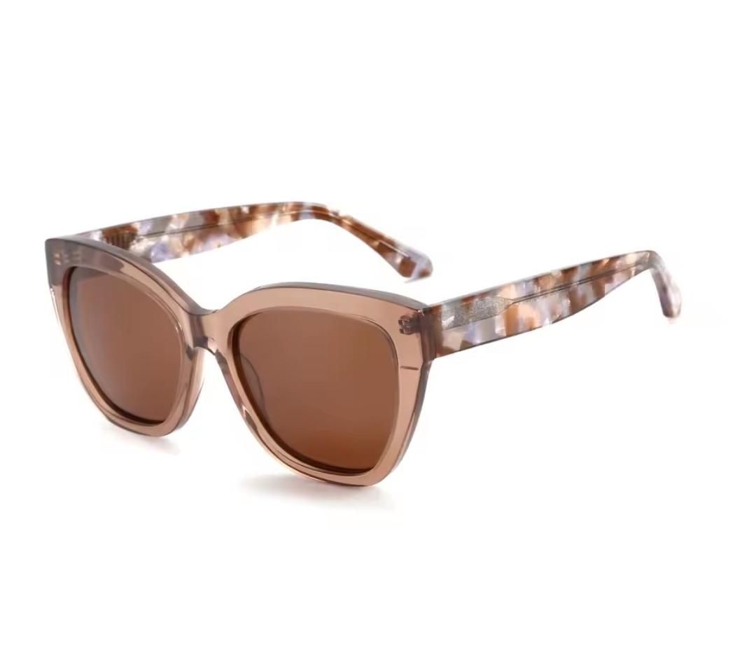 Translucent caramel soft cat-eye with pink-tortoise temples and solid brown lens