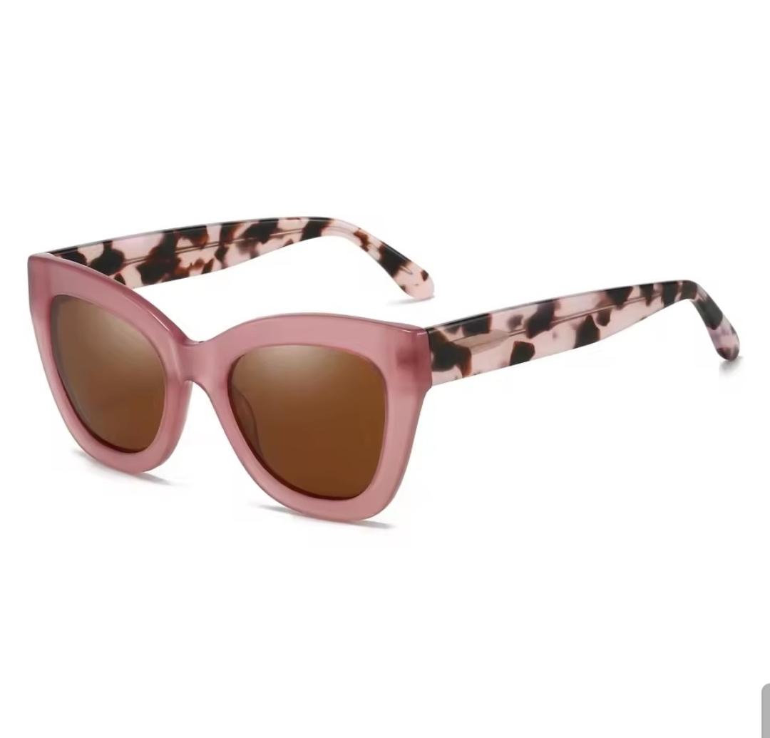 Dusty pink soft cat-eye with pink-cream tortoise temples and solid brown lens